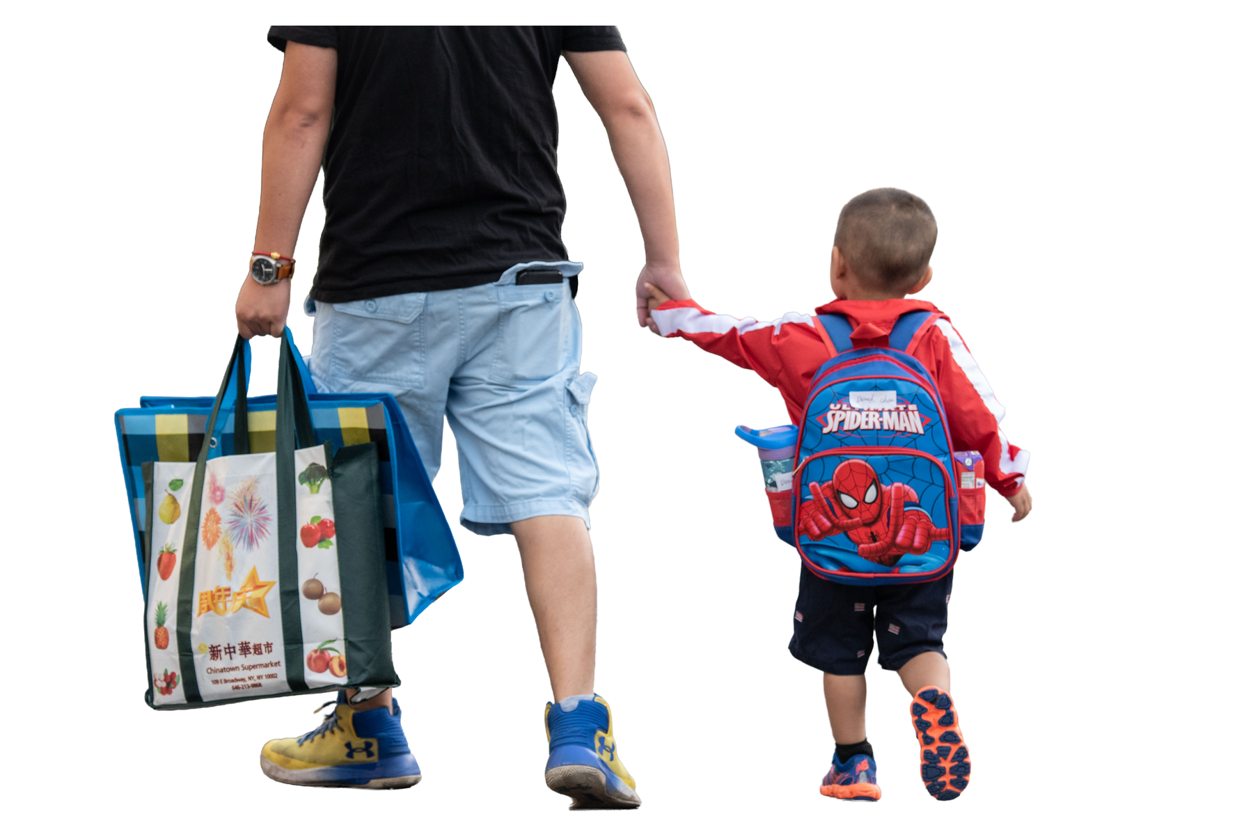 A parent and child walking to school